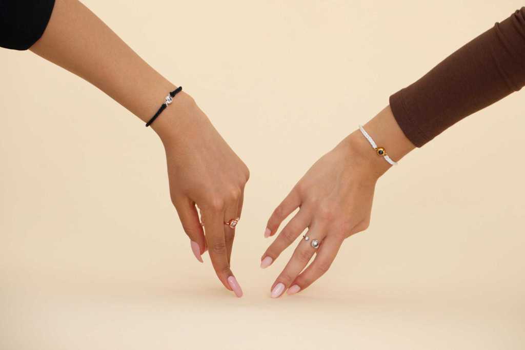 Two arms wearing Photo bracelets