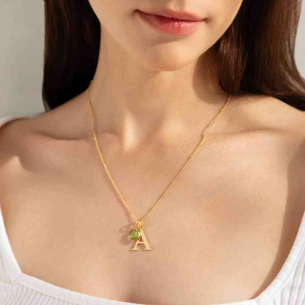 gold initial necklace with august birthstone