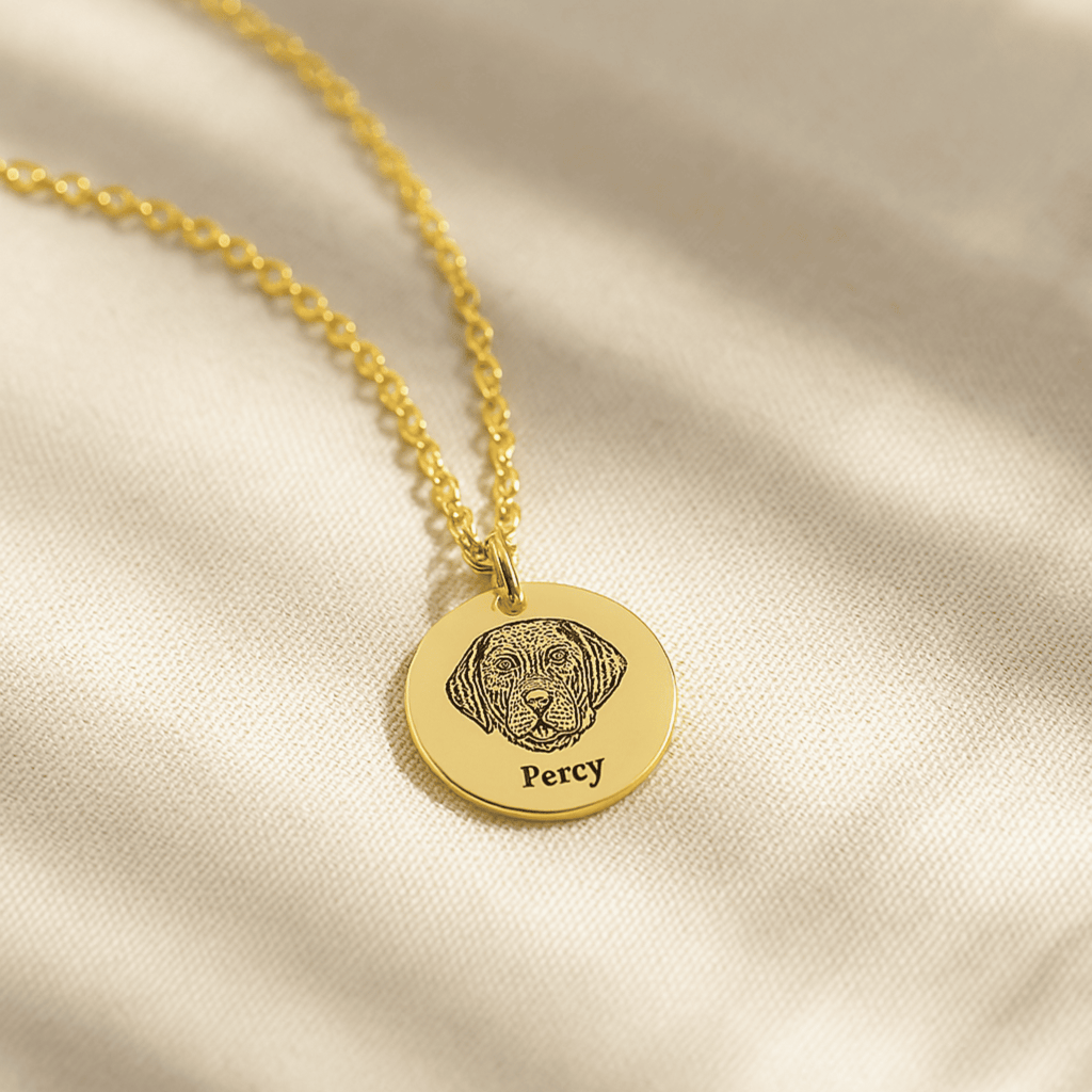 Gold pet face necklace with a dog's face engraved onto the pendant