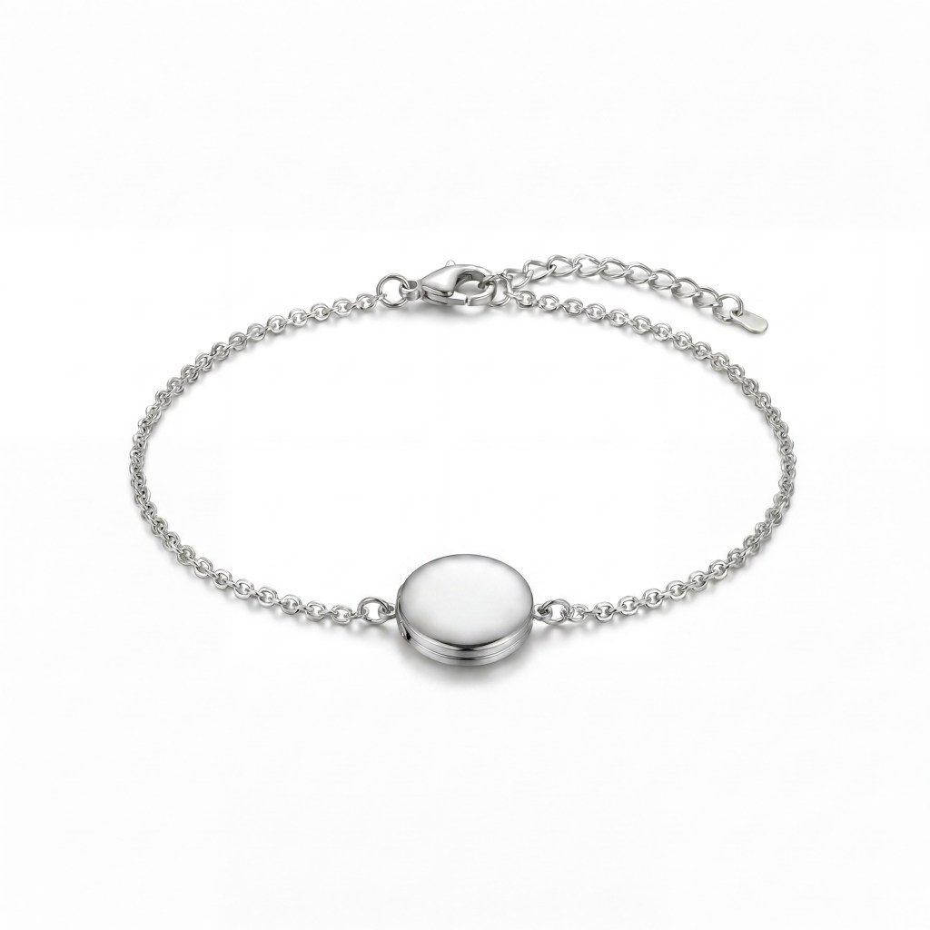 Silver necklace with a round, smooth pendant on a delicate chain, set against a white background, visible clasp at the top edge.