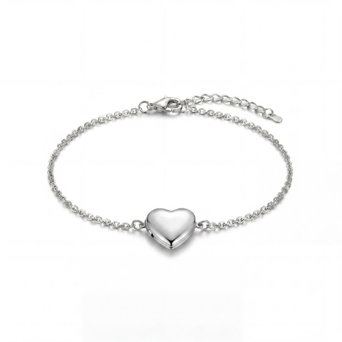 Silver heart-shaped pendant on a delicate chain against a white background.