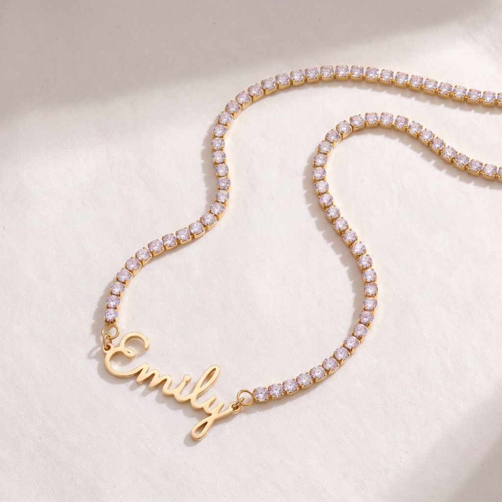 Gold diamond-studded bracelet arranged in curves on a pale fabric surface, showcasing sparkling stones in gold settings.